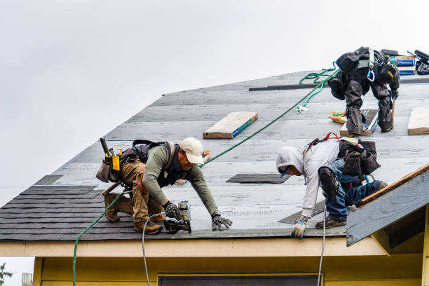 Professional Gutter Installation technician working in Raymond, WA